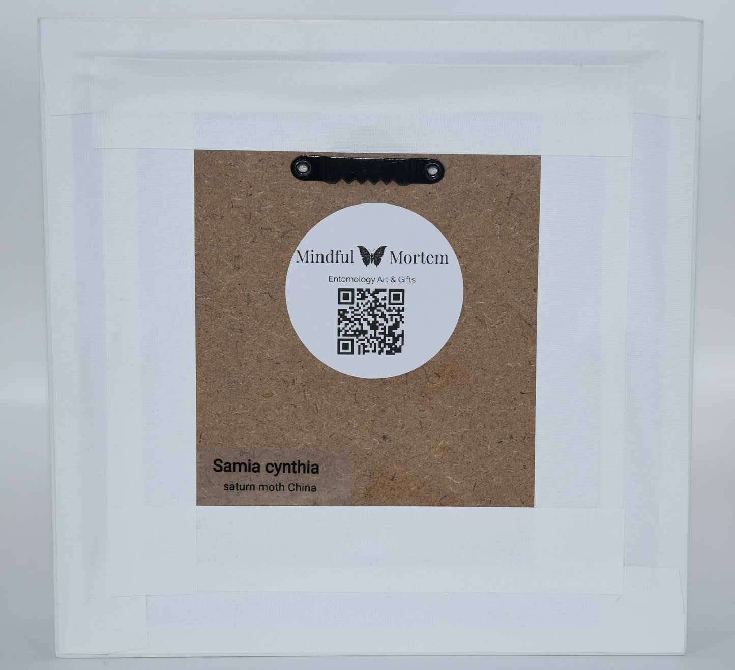 Product packaging with a label and QR code on a white background