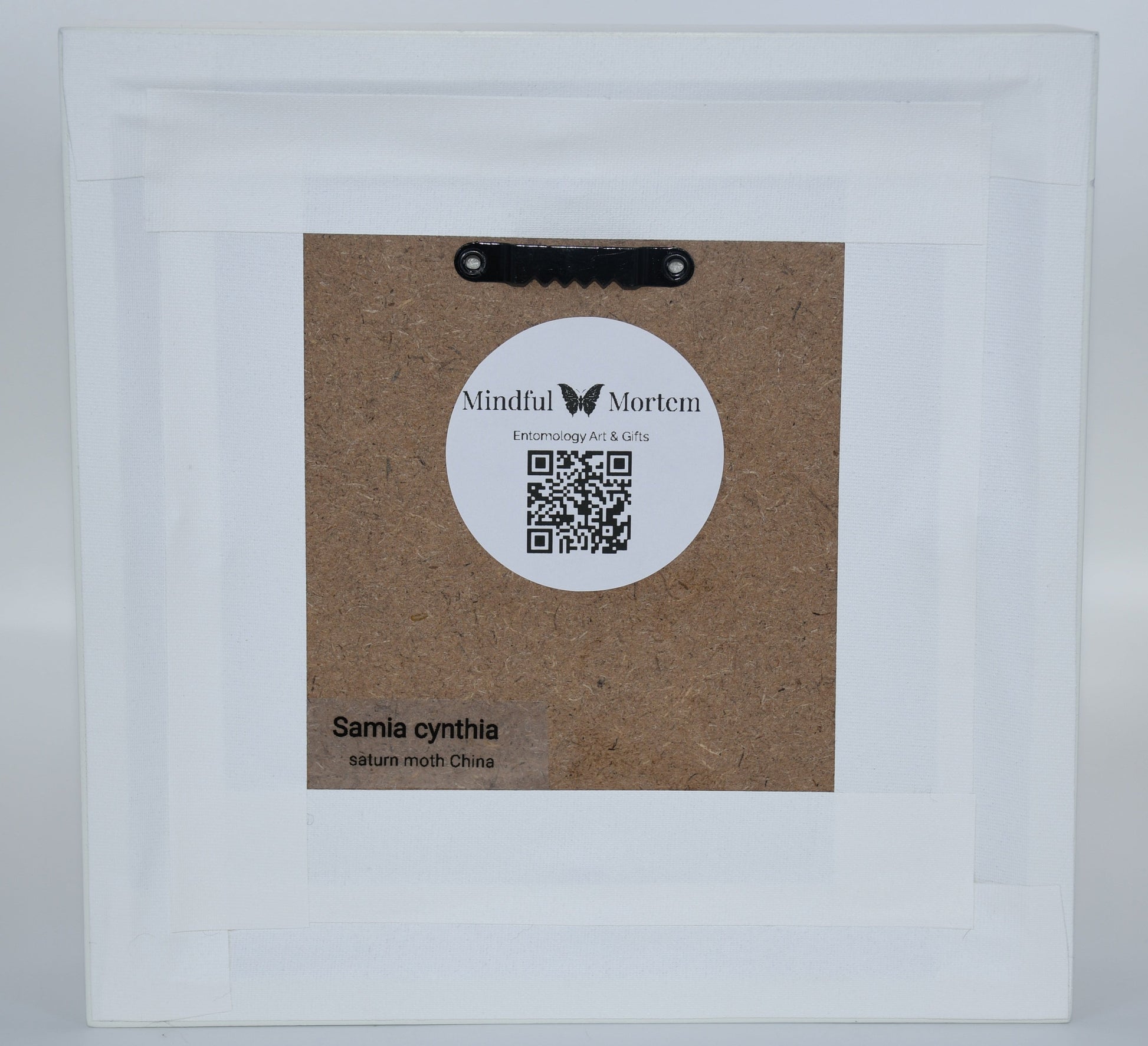 Product packaging with a label and QR code on a white background
